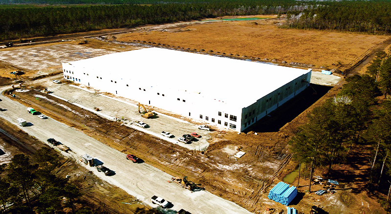 Warehouse in a big open field.